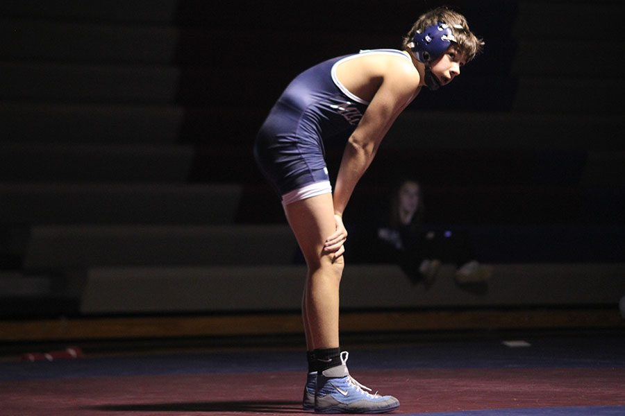 During his match Freshman Austin Keal catches his breath. 