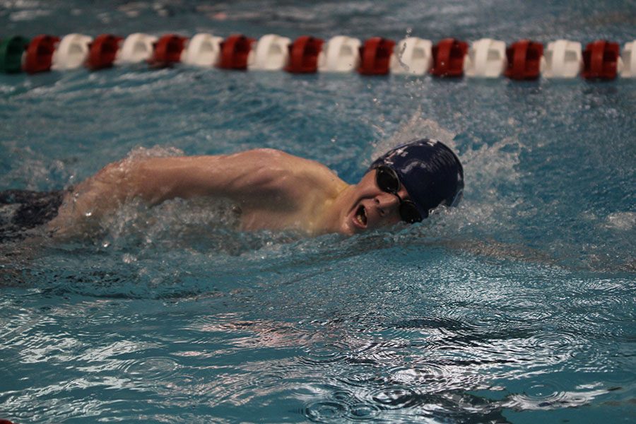 Swimming in the 200 yard freestyle, junior Jacob Soderling turns his head for a breath.