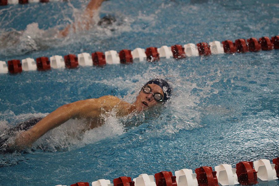 Freshman Avery Lawson competes in the 50 yard freestyle.