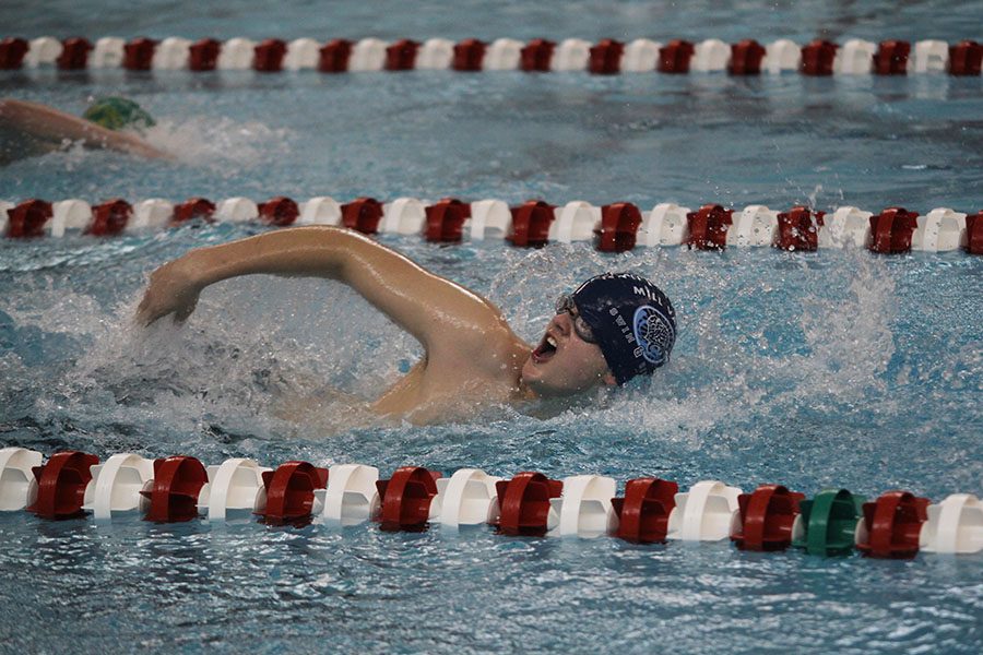 With sophomores Ethan Forristal, Drew Thomas and Jakob Twigg, junior Brennan Shulte swims in the 200 yard freestyle relay.