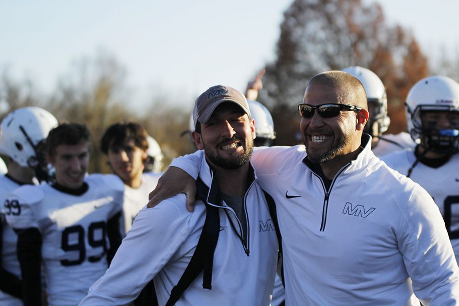 Head coach Joel Applebee and co-offensive coordinator Thomas O’Neill celebrate their second state football championship.