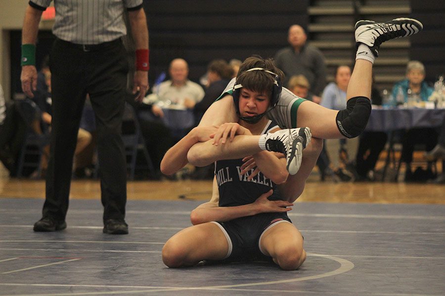 As his opponent is on his back, freshman Austin Keal continues to wrestle.