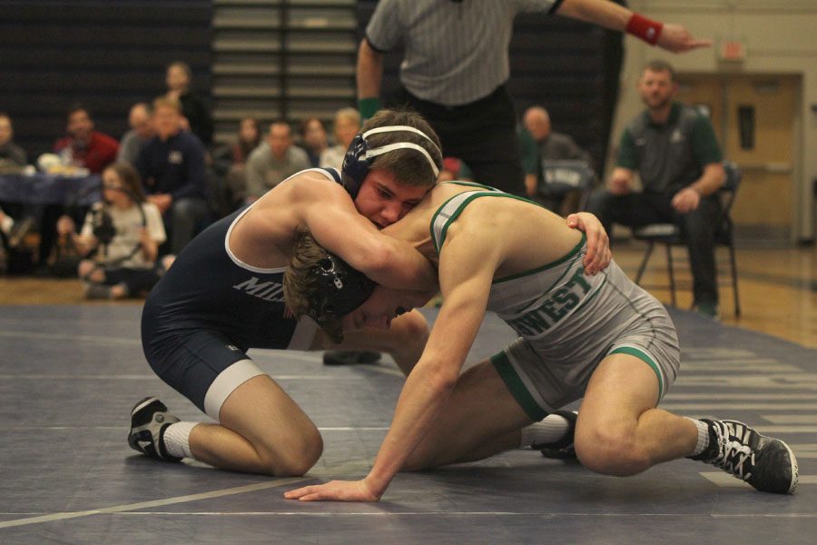 Junior Conner Ward stuffs the head of his opponent.