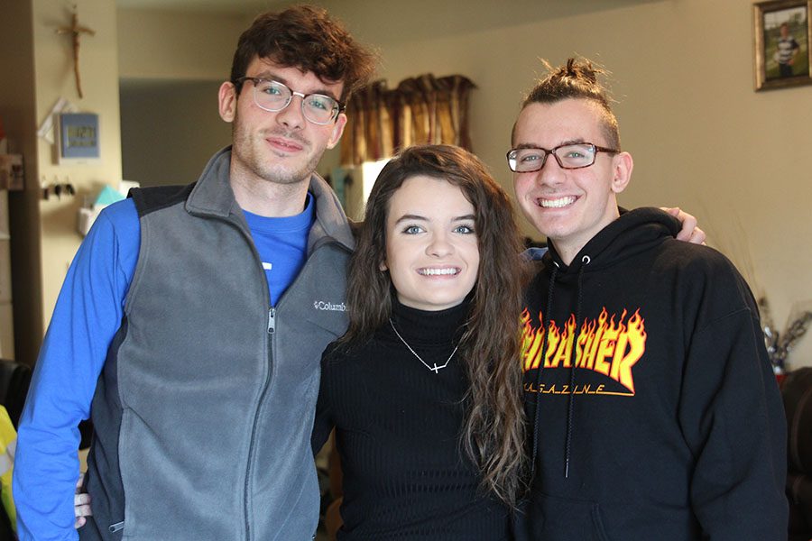 Relaxing in the comfort of their home, seniors Anthony, Cindy and Marcel Meljanac enjoy exploring many hobbies and spending quality time with each other.