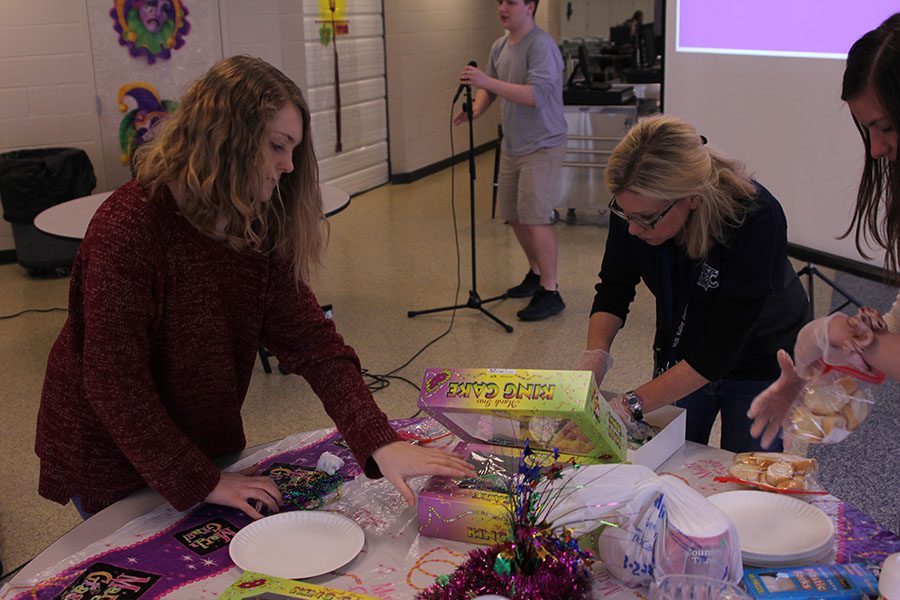 Junior Dani Crispin and French teacher Charisse Highlander prepare king cake for Mardi Gras on Friday, Feb. 24.