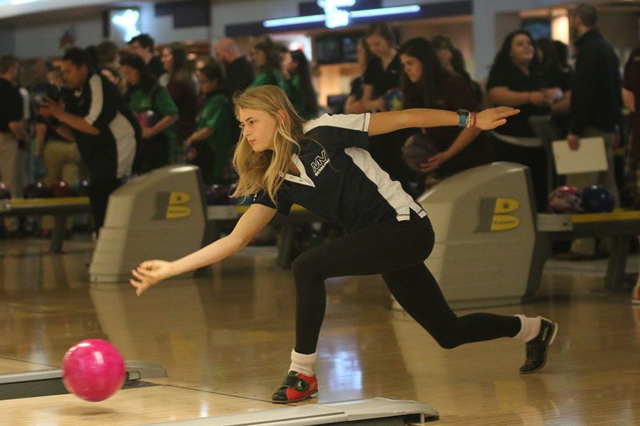 While bowling, junior Bella Hadden releases her bowling ball.