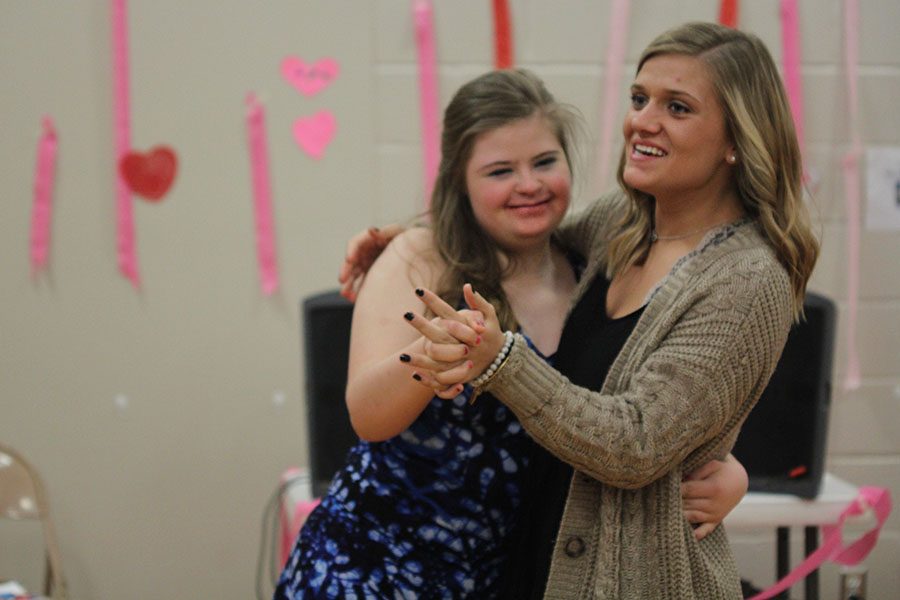 Senior Sidney Lawyer dances with freshman Maria McElwee.