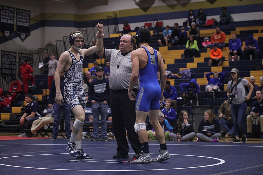 At the end of junior Jarrett Bendures match the ref raises his hand to show he won. 