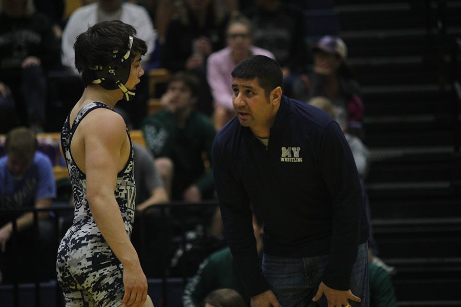 During his opponents blood time, junior Bryson Markovich talks with coach Keal. 