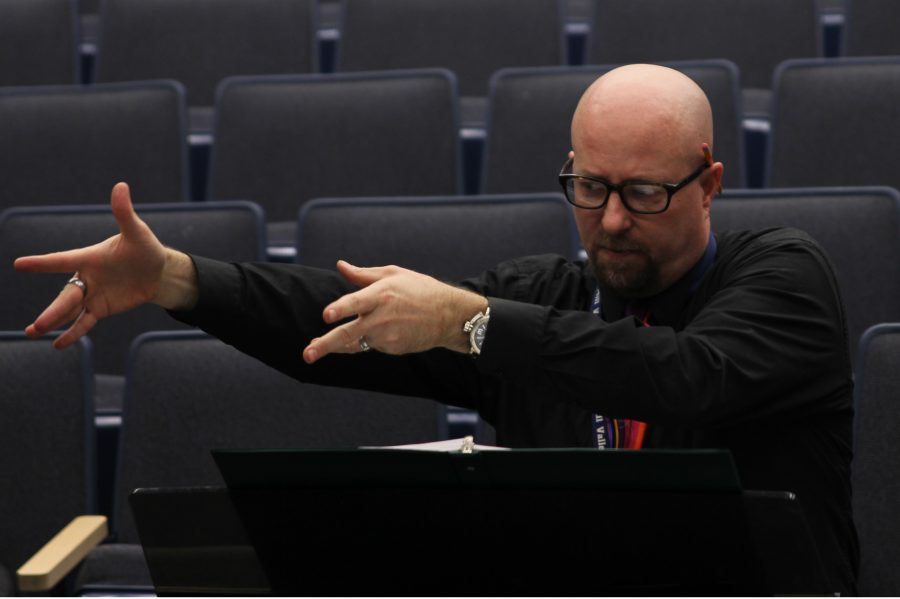Drama teacher Jon Copeland instructs those performing in the musical on Thursday, Feb. 23.