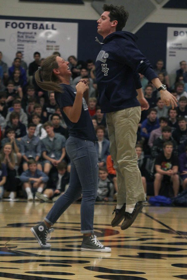 As a part of their introduction, winter homecoming candidates Kacey Blair and Ross Acre chest bump.