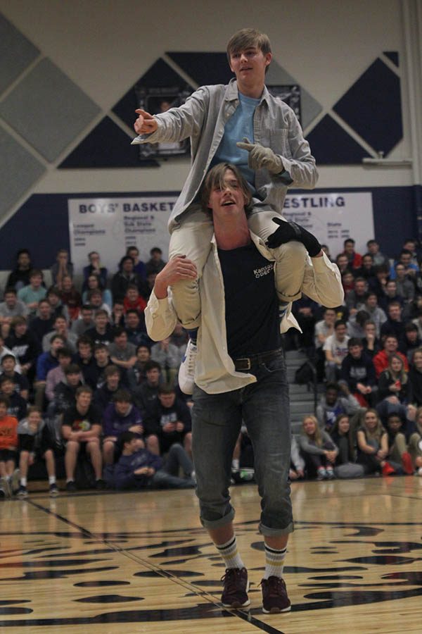 Senior Garrison Fangman lifts senior Aaron Kofoid as a part of their dance routine. 