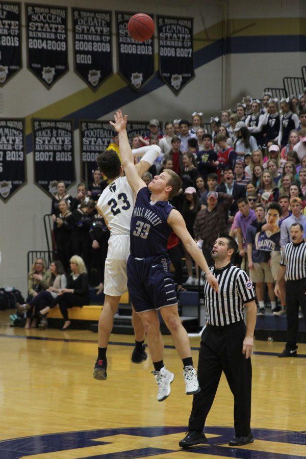 To start the game, junior Brody Flamming jumps up to gain possession of the ball.