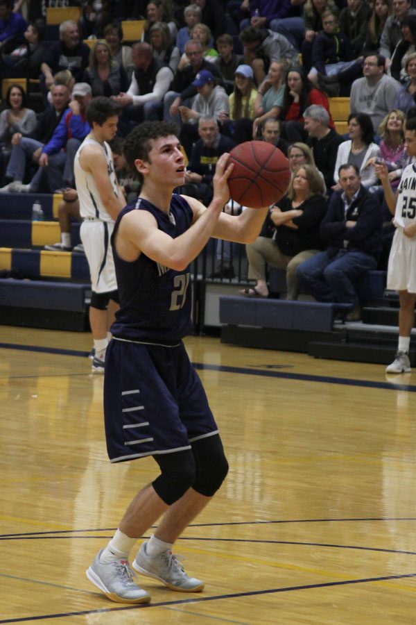 After a technical called on the Saints, senior Blake Montgomery shoots two free throws.