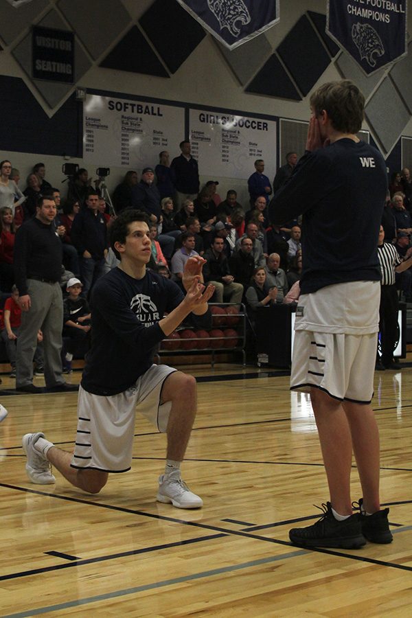 As they announce the starters, junior Mason Little proposes to senior Jack Cooper.