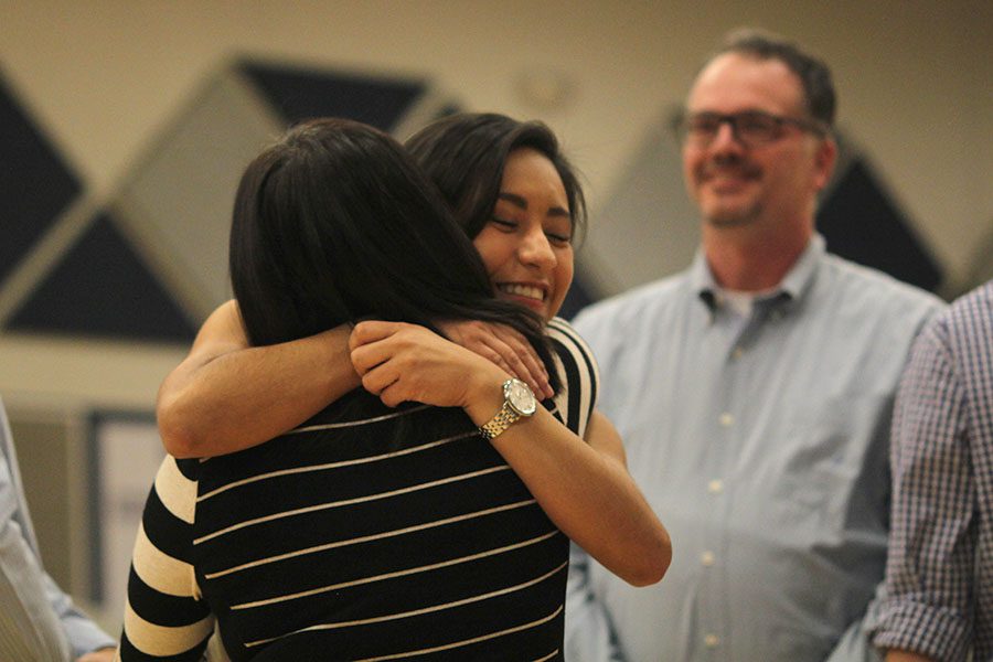 After making it to half-court, senior Mariana Cruz hugs her mom.