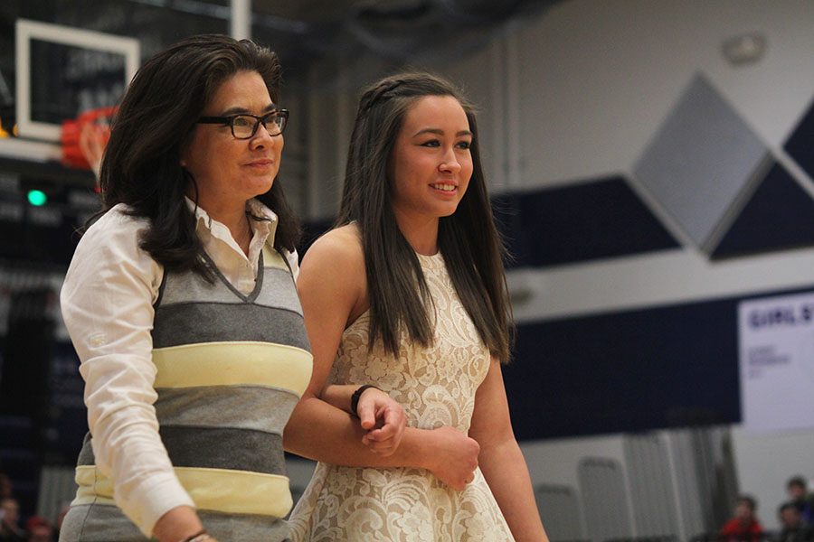 Senior Haley Pultz smiles while walking with her mom. 