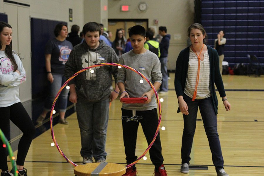 Eighth grade students fly a drone at the Jag Wars. 