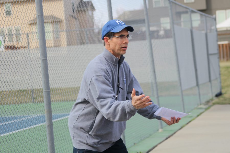 Boys tennis coach Steve Bock starts off practice on Tuesday, March 21. I only have them from March, Bock said. We practice for three weeks, then were off to the races.