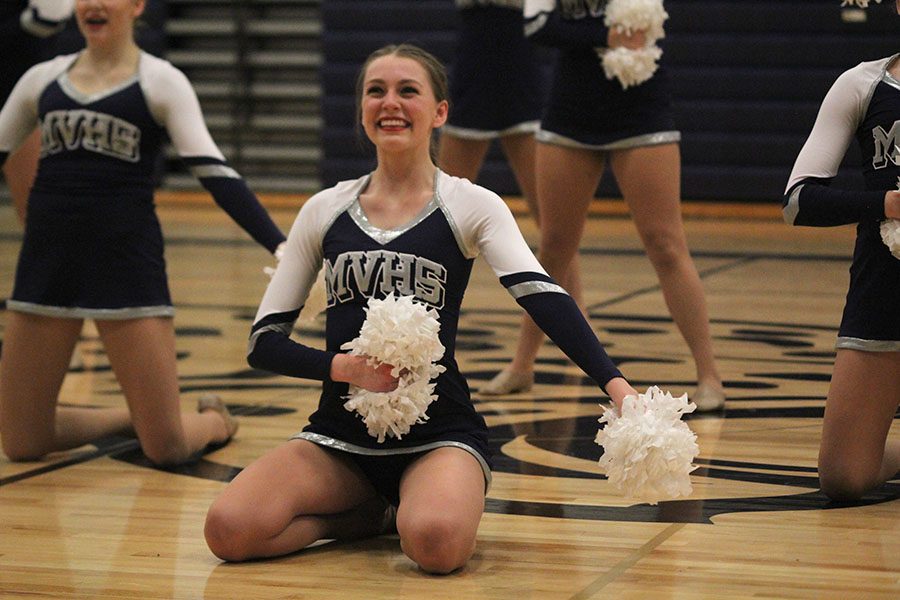 Senior Julia Kemp smiles during the pom routine.