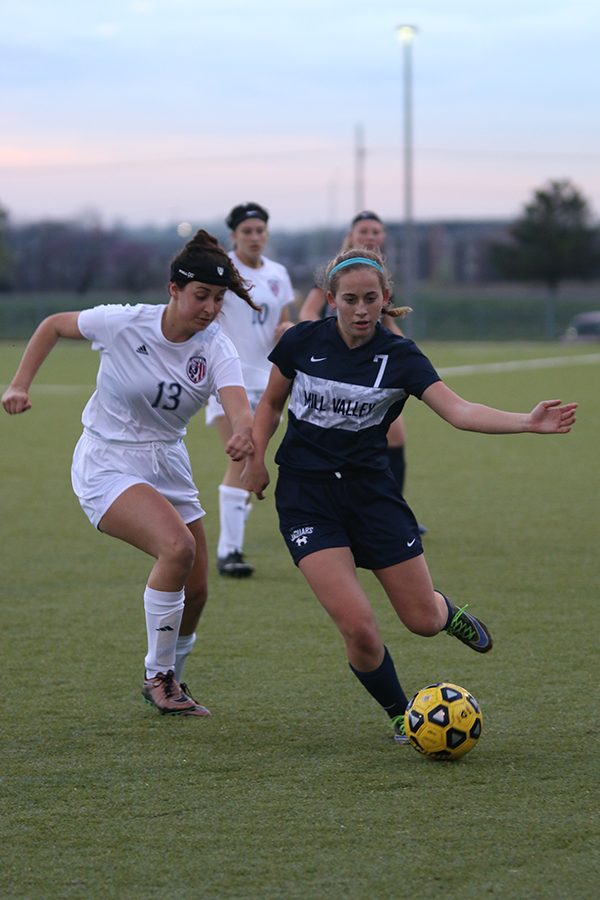 Junior Madison Irish races after the ball before passing it to her teammate.