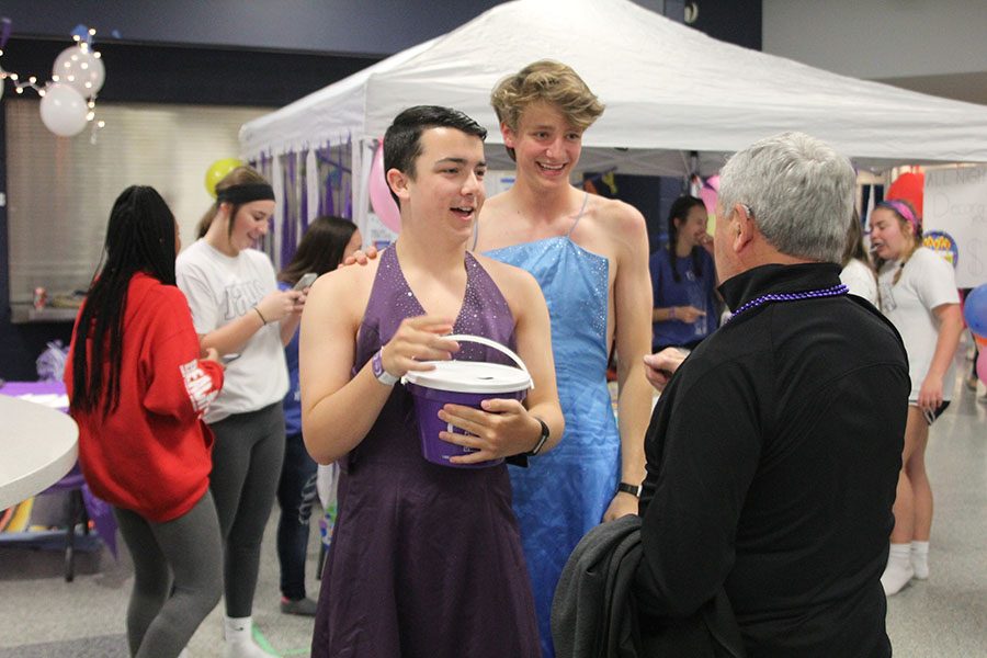 Seniors Collin Petigna and Spencer Butterfield ask for donations during the the Mr. Relay competition. 