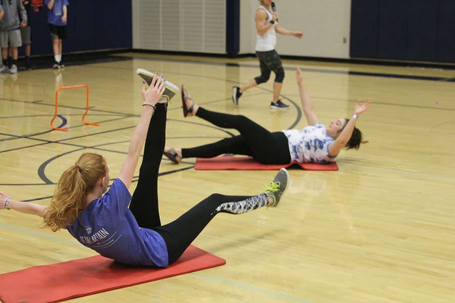 Students participate in an obstacle course. 