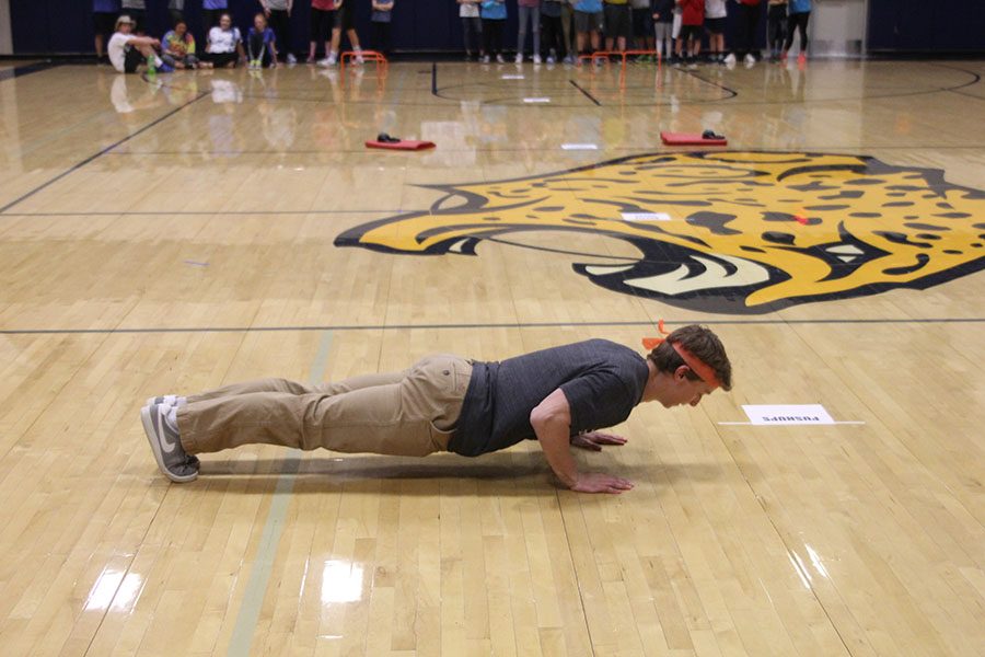 Junior Carter Lawson participates in an obstacle course. 