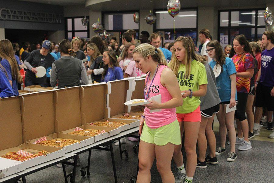 Juniors Adde Hinkle and Madison Irish participate in a midnight pizza party. 
