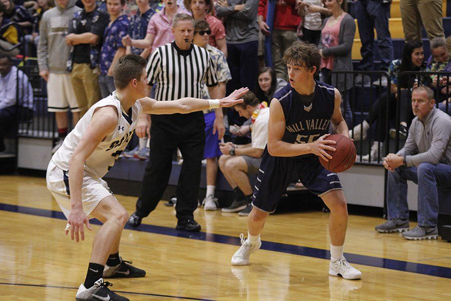 At the sub-state game against Aquinas, sophomore Tanner Moore gets ready to sprint towards the basket.