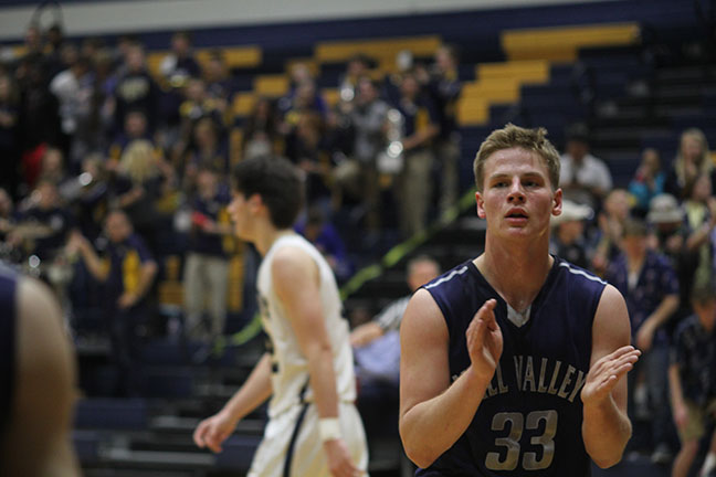 Junior Brody Flaming claps as one of his teammates scores.