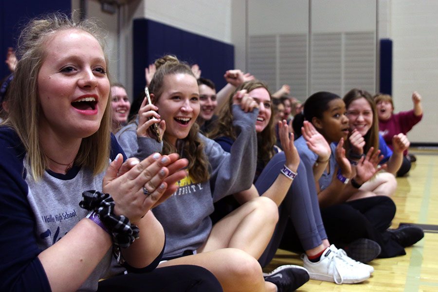 Senior Kaylie McLaughlin applauds and cheers to support survivors during the opening ceremony at Relay for Life on Friday, March 31.