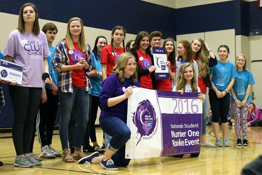 Members of last years Relay for Life committee accept a national award during the opening ceremony.