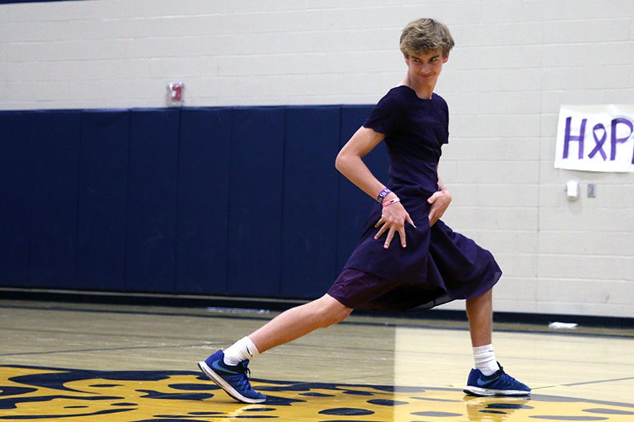 Turning to the side, freshman Gavin Fangman makes eye contact with the judges during the Mr. Relay competition. 