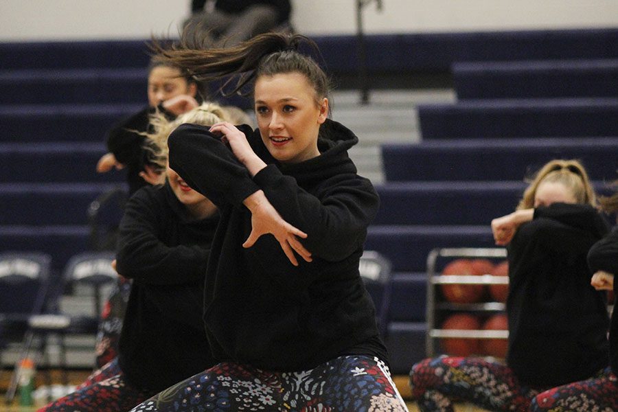 During halftime, senior Kat Rouse dances with the Silver Stars.
