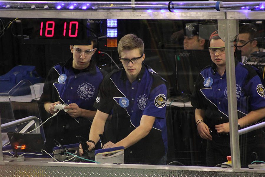 During their quarterfinals match at the Greater Kansas City Regional on Saturday, March 18, seniors Jacob Tiehen and Marc Hinnen focus on driving the robot. 