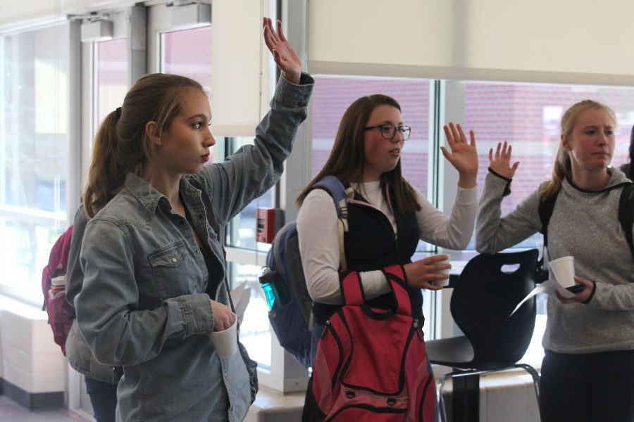 During the StuCo student forum on Tuesday, March 7, sophomore Kate Backes raises her hand. 