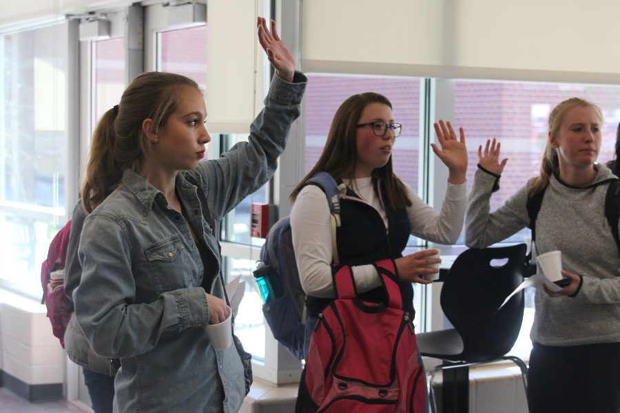 During+the+StuCo+student+forum+on+Tuesday%2C+March+7%2C+sophomore+Kate+Backes+raises+her+hand.+