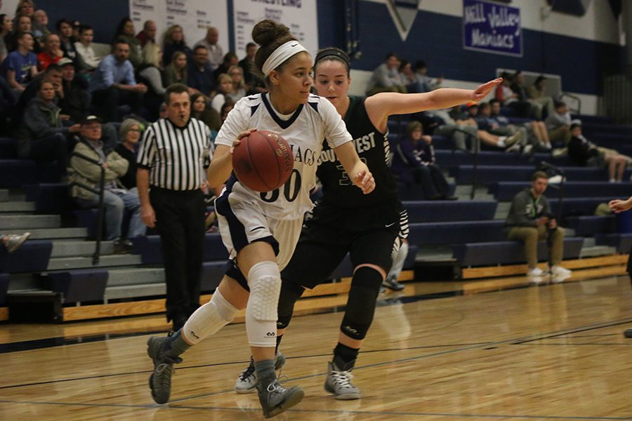 Senior Elena Artis dribbles past an opponent