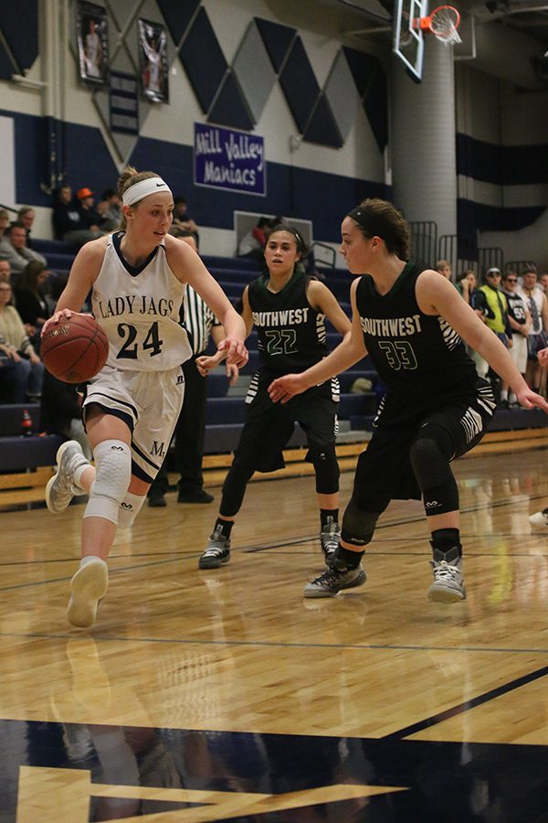 Junior Evan Zars dribbles the ball.