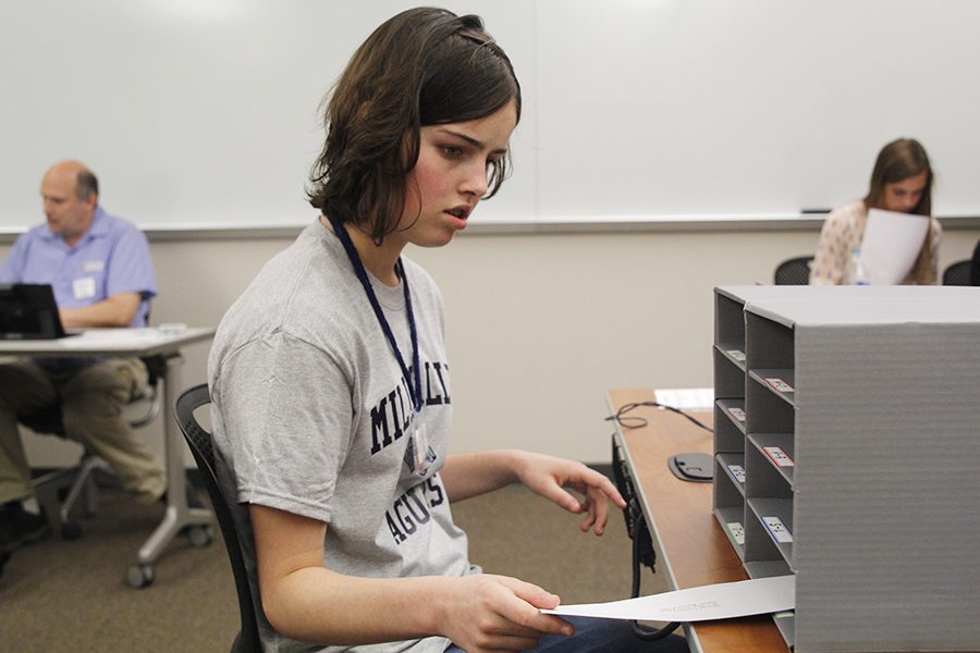 During the letter sorting event, sophomore Karsyn Aylward puts letters into their respective boxes.