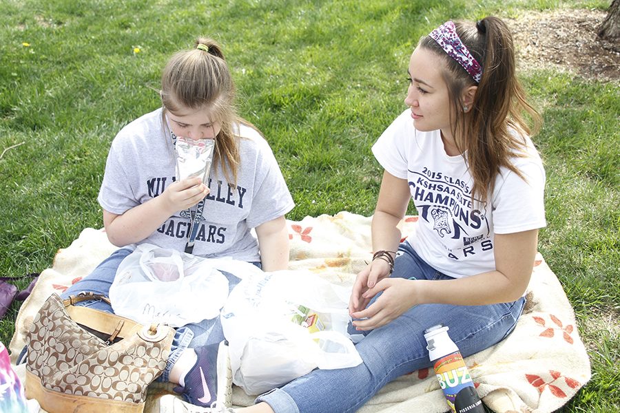 Senior Haley Pultz and freshman Maria McElwee have a picnic during their lunch break.