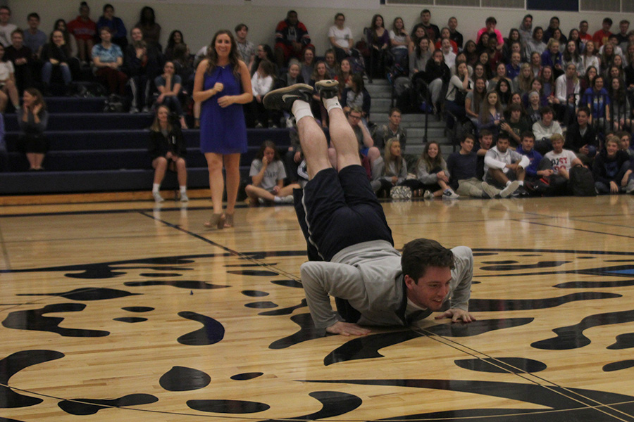 Senior Ross Acree does the worm during the student scavenger hunt activity.