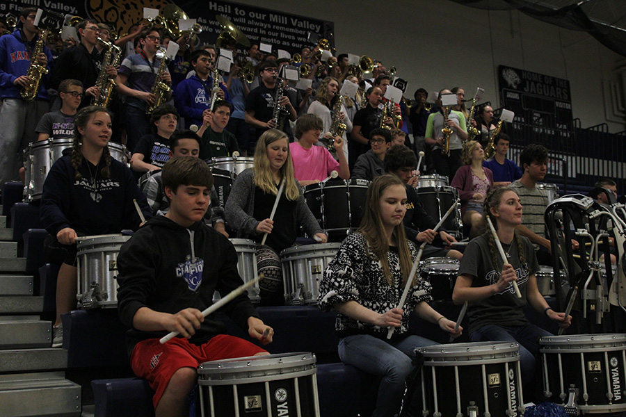 Kicking off the last assembly of the year, the band plays the fight song.