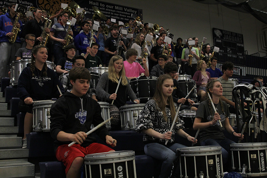 Kicking off the last assembly of the year, the band plays the fight song.