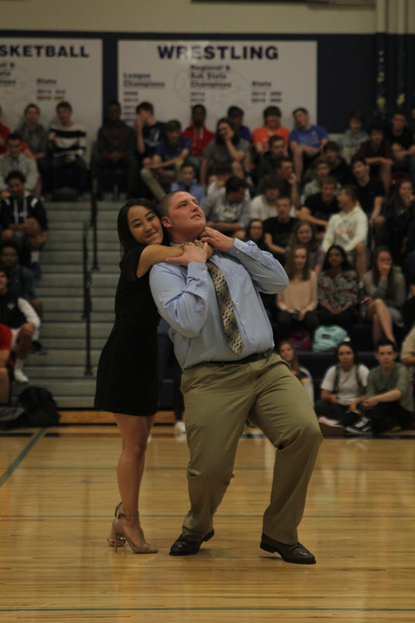 Senior Sue Kim puts senior Jake Campbell in a headlock as a part of their introduction dance routine.