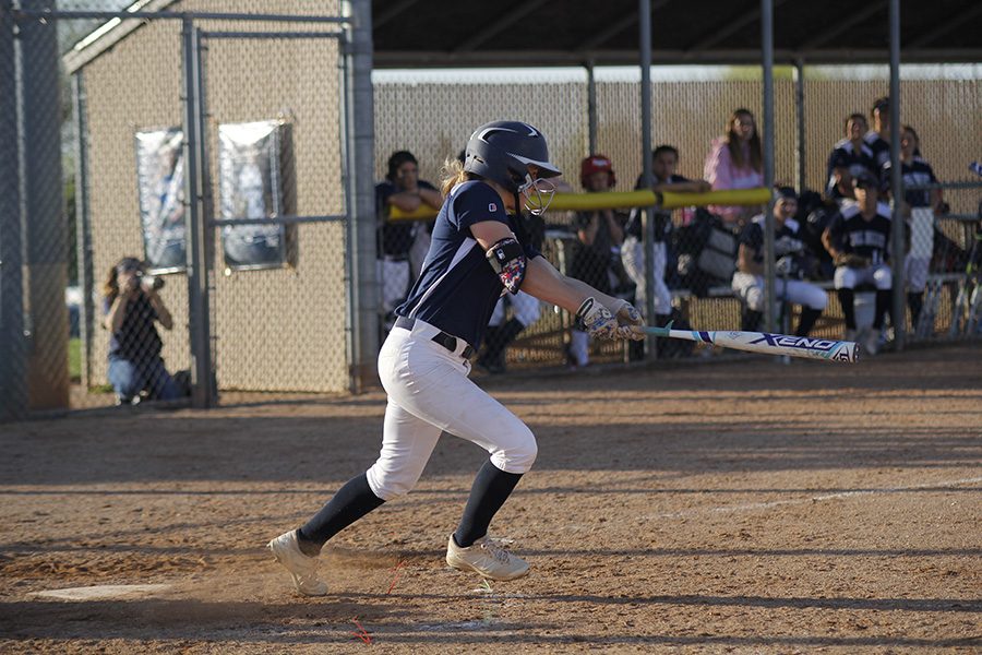 Swinging the bat, sophomore Payton Totzke prepares to run to first base on Monday, April 17.