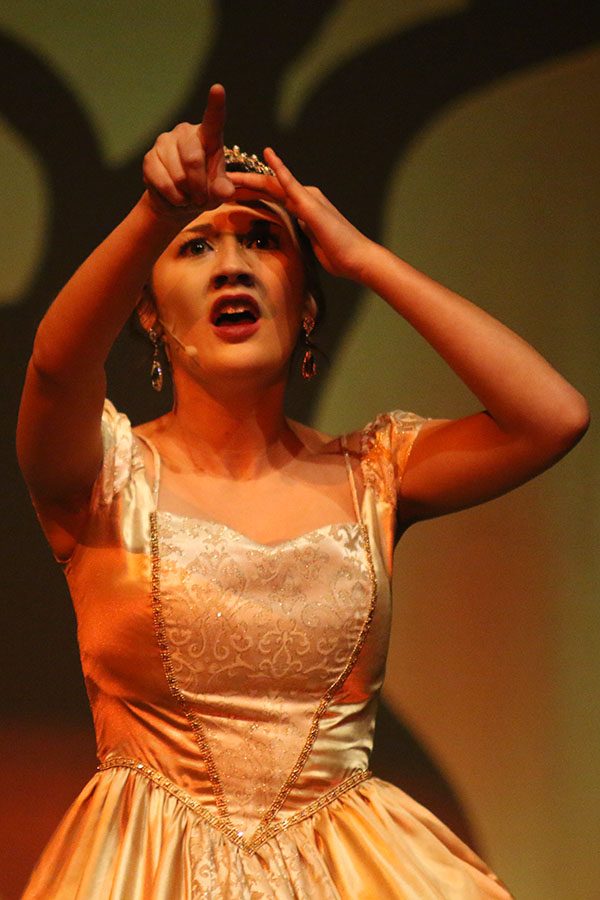 Cinderella, played by senior Natalie Carrera, looks out at Jack's beanstalk.