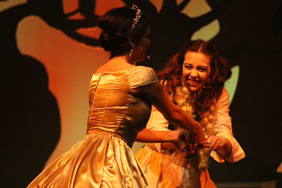 The Baker's Wife, played by senior Lisa Earlenbaugh, steals Cinderella's golden slipper, played by senior Natalie Carrera.