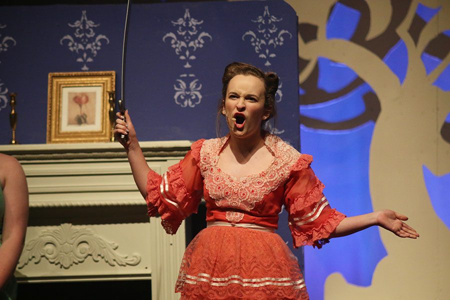 During "Finale Part 1," Cinderella's Stepmother, played by sophomore Ashlyn Windmiller, prepares to cut her daughter's foot in order to fit into Cinderella's golden slipper.